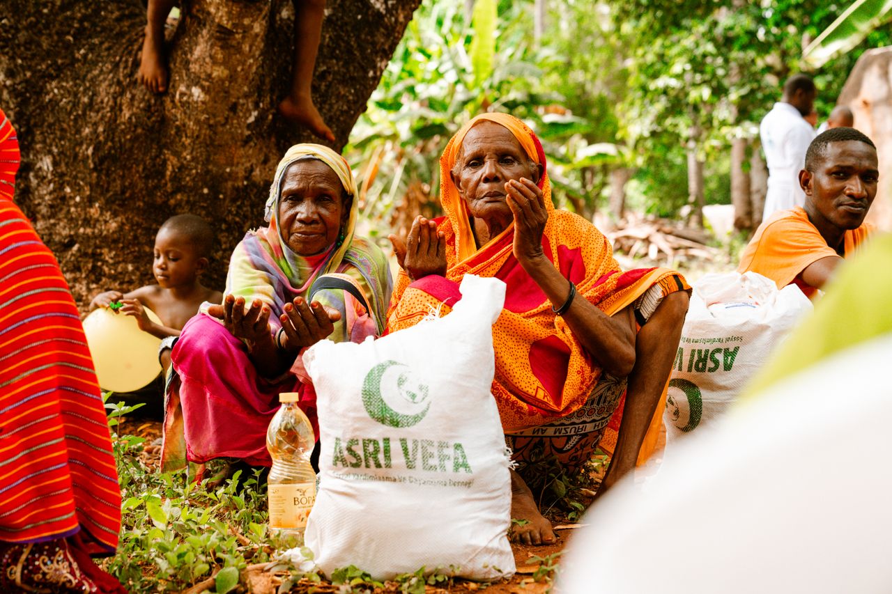 Mastering the First Impression: Your intriguing post title goes here People gathered outdoors for food distribution, showcasing community support and aid.